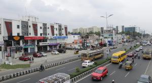 a busy city street filled with lots of traffic at Venture Park, OMR, Thoraipakkam, Chennai in Chennai