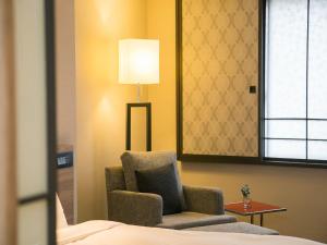 Letto o letti in una camera di Royal Inn Taipei Nanxi - MRT Zhongshan Station