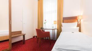 Postel nebo postele na pokoji v ubytování Hotel Fürst Bismarck