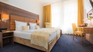 Postel nebo postele na pokoji v ubytování Hotel Fürst Bismarck