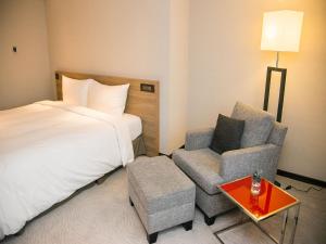 Letto o letti in una camera di Royal Inn Taipei Nanxi - MRT Zhongshan Station