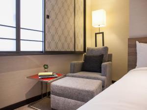 Letto o letti in una camera di Royal Inn Taipei Nanxi - MRT Zhongshan Station