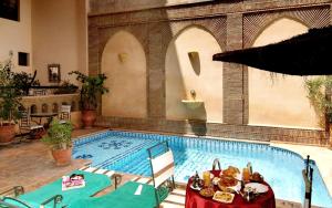 Bazén v ubytování Amani Hotel Suites & Spa nebo v jeho okolí