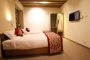 Letto o letti in una camera di Hotel Heranya
