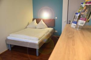 
Ein Bett oder Betten in einem Zimmer der Unterkunft Boardinghouse Campus Lounge
