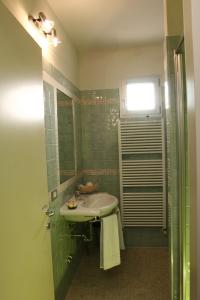a bathroom with a sink and a shower at Residence La Dolce Vita in Rimini