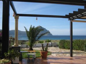 a patio with a view of the ocean at Villa vista MARE a MÀKARI in San Vito lo Capo