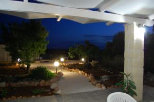 a night view of a patio with lights at Villa Marianna in Ostuni