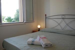 Llit o llits en una habitació de Villa Marianna