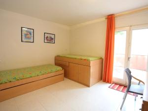 מיטה או מיטות בחדר ב-Apartment Gladiols by Interhome