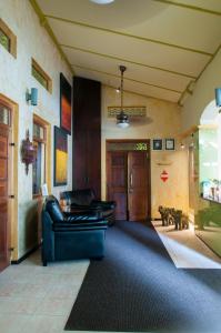 a living room with a couch and a door at Sala Boutique Hotel in Male City