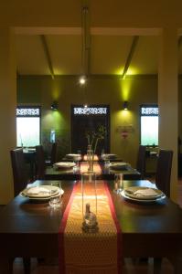 a large dining room with a long table with chairs at Sala Boutique Hotel in Male City