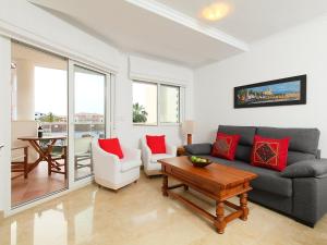 a living room with a couch and a table at Apartment Estrella del Mar by Interhome in Denia
