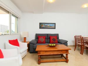 a living room with a couch and a coffee table at Apartment Estrella del Mar by Interhome in Denia +18 photos