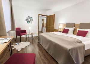 Postel nebo postele na pokoji v ubytování Hotel & Restaurant Lamm
