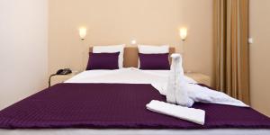 Postel nebo postele na pokoji v ubytování Aparthotel Praiano