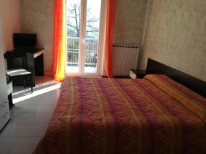 Una cama o camas en una habitación de Hotel Nido delle Rondini