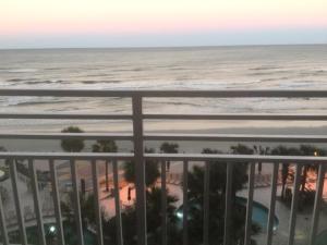 a view of the beach from the balcony of a resort at Ocean Walk Resort 702 in Daytona Beach