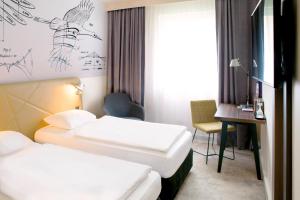Säng eller sängar i ett rum på Mercure Hotel Berlin City
