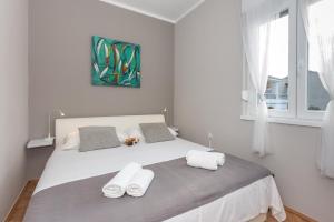 Postel nebo postele na pokoji v ubytování Apartments Come&Stay