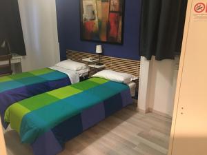Postel nebo postele na pokoji v ubytování Almi Rooms