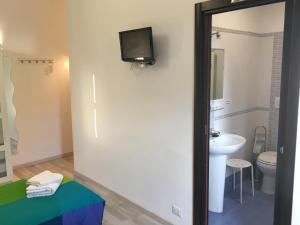 Koupelna v ubytování Almi Rooms