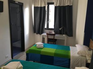 Postel nebo postele na pokoji v ubytování Almi Rooms