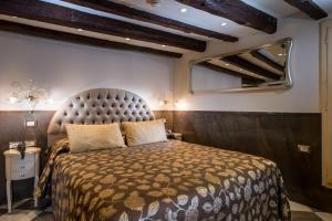 A bed or beds in a room at Ca' Marinella