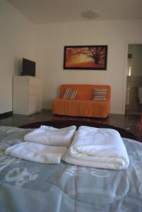 Een bed of bedden in een kamer bij Agli Ospedali