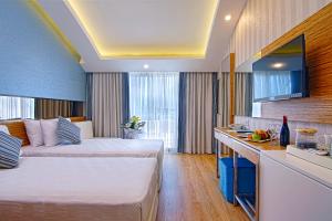 Postel nebo postele na pokoji v ubytování Dosinia Luxury Resort-Ultra All Inclusive
