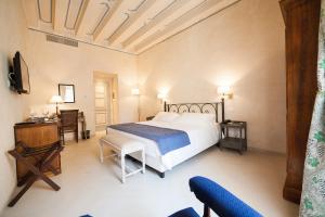 Ένα ή περισσότερα κρεβάτια σε δωμάτιο στο Algilà Ortigia Charme Hotel