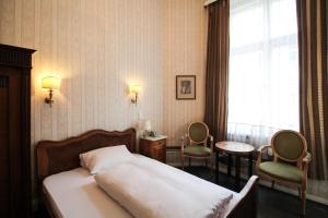 Postel nebo postele na pokoji v ubytování Hotel-Pension Funk am Kurfürstendamm
