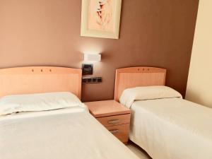 Postel nebo postele na pokoji v ubytování Hostal Meseguer