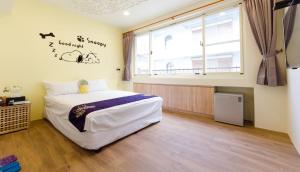 Giường trong phòng chung tại YOYO 11 House