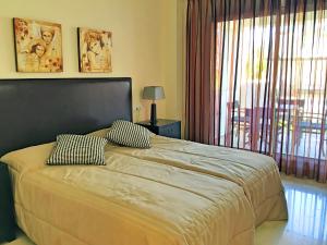 Cama ou camas em um quarto em Apartment La Mesana by Interhome