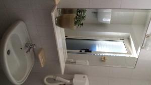 Koupelna v ubytování Hotel Le Viole