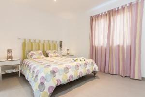 A bed or beds in a room at Llevant