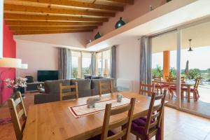 a living room with a wooden table and a couch at Son Bordils in Inca