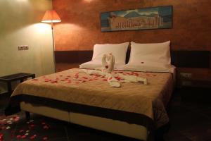 Abalon Pompei Resort客房内的一张或多张床位