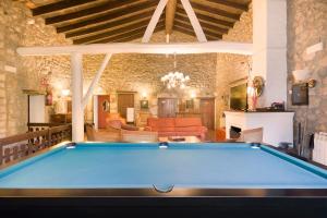 a pool table in the middle of a living room at Sant Marçal del Montseny in Montseny