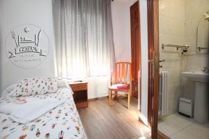Posteľ alebo postele v izbe v ubytovaní Hostal Restaurante Central