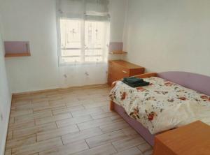 Postel nebo postele na pokoji v ubytování Apartments Tazacorte Beach 2-3 floor