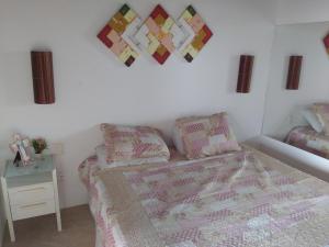 En eller flere senger på et rom på Apartamento Taíba Beach Resort