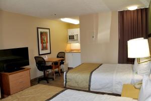 Tempat tidur dalam kamar di Extended Stay America Suites - Albuquerque - Airport