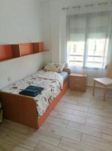 Postel nebo postele na pokoji v ubytování Apartments Tazacorte Beach 2-3 floor