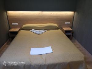 Voodi või voodid majutusasutuse Letuchaya Mysh Hotel toas