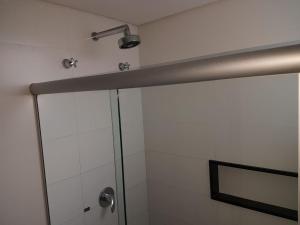 a bathroom with a shower with a glass door at Style Hotel ( Adults Only) in São Paulo +36 photos