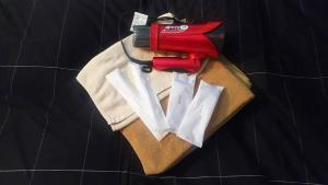 a pair of scissors and a shirt on a table at Hotel Yumeya in Fukuoka