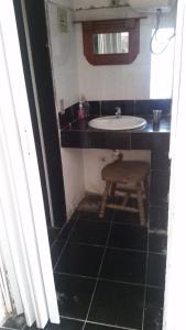 a bathroom with a sink and a stool in it at mi pesadilla2 in Salinas  +13 photos