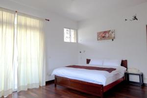 Łóżko lub łóżka w pokoju w obiekcie Alice Springs Homestay